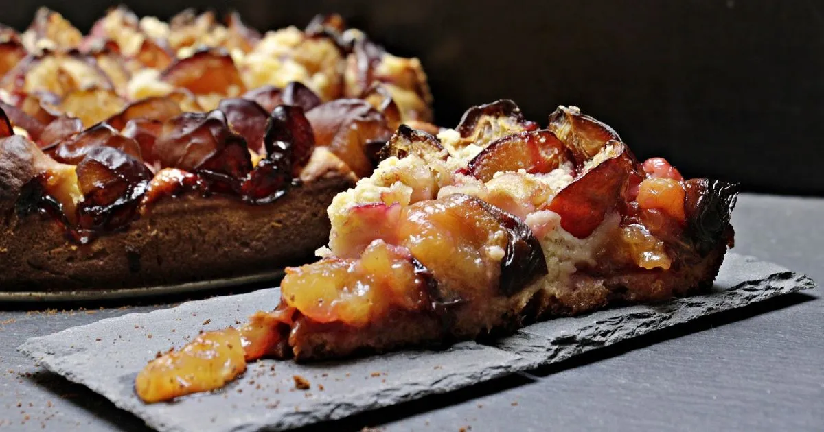 Cake Mix Cobbler Recipe for a Sweet, Easy Dessert A golden-brown Cake Mix Cobbler with a crispy topping and bubbling fruit filling in a rustic baking dish.